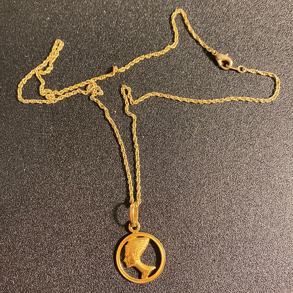 Nefertiti gold emblem on chain